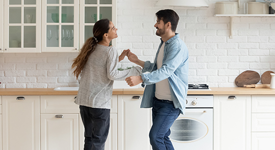 Couple dancing in house